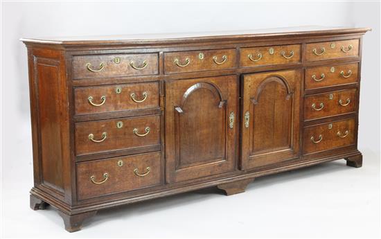 A George III oak dresser base, W.7ft 6in. D.1ft 8in. H.3ft 2in.